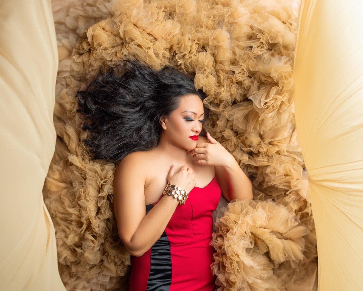 Leimomi in a red editorial portrait