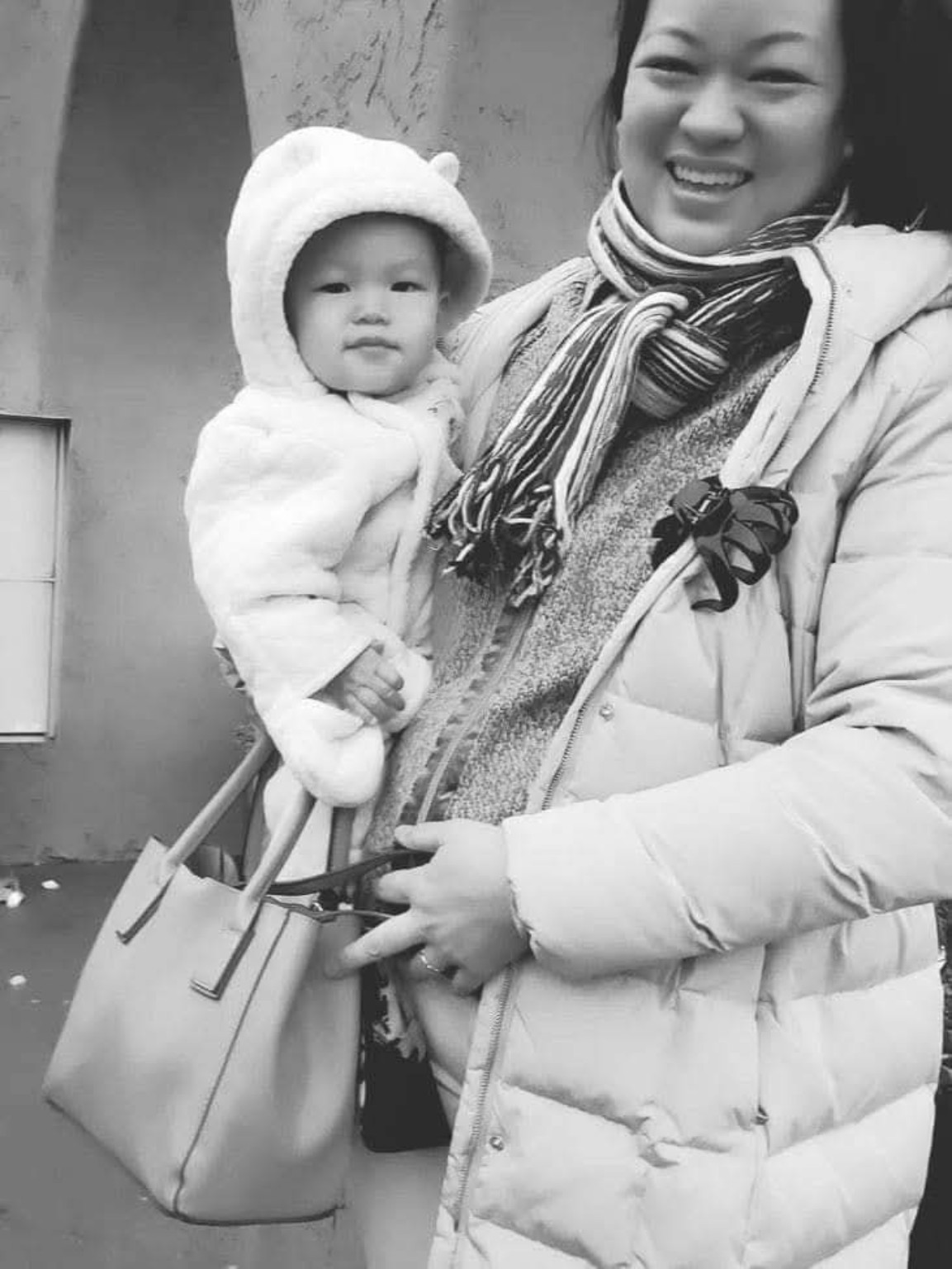 Leimomi holding baby Suryla during an earlier season of family life and travel