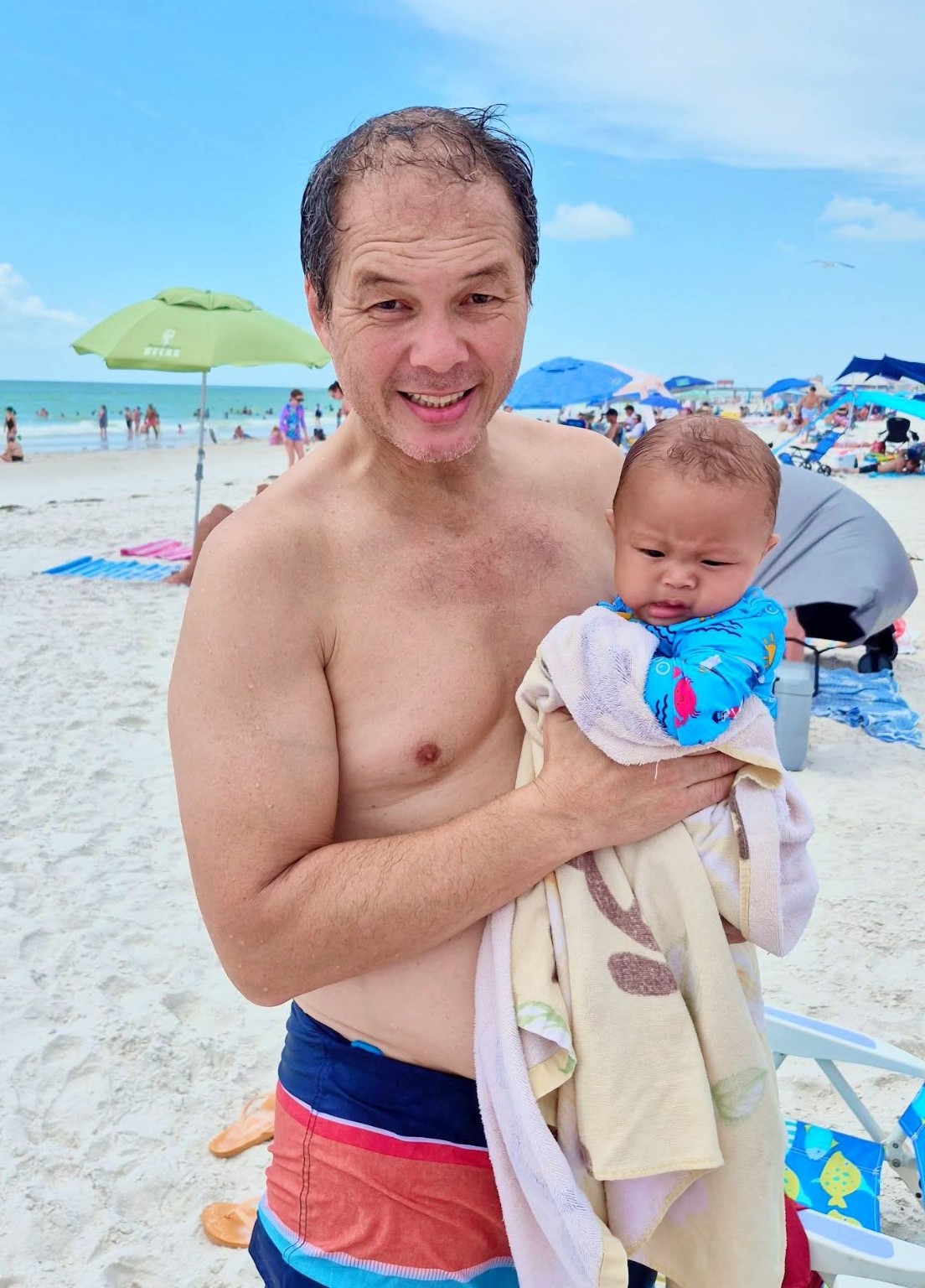 Edward holding baby Koa at Clearwater Beach