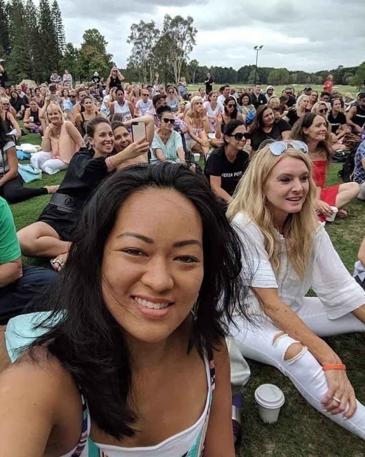Leimomi at a large outdoor community gathering